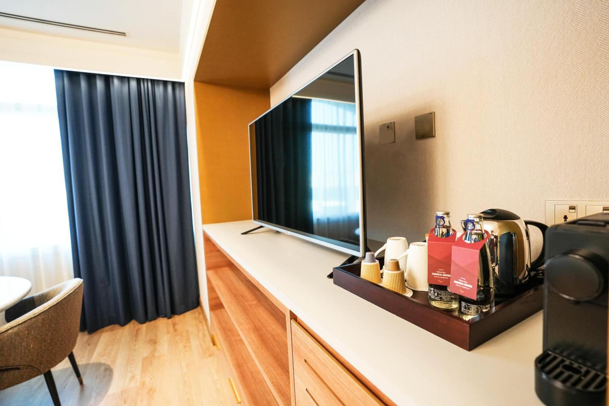 Moevenpick Grand Al Bustan Hotel Dubai Bagian luar foto A Nespresso machine in a hotel room